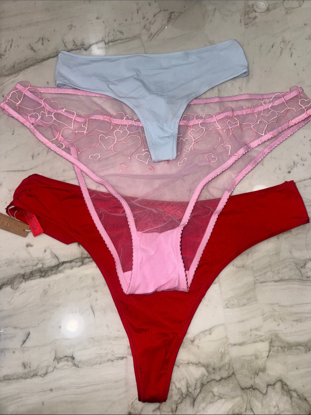 SKIMS Three-Pack Thong Set in Light Blue, Pink & Red